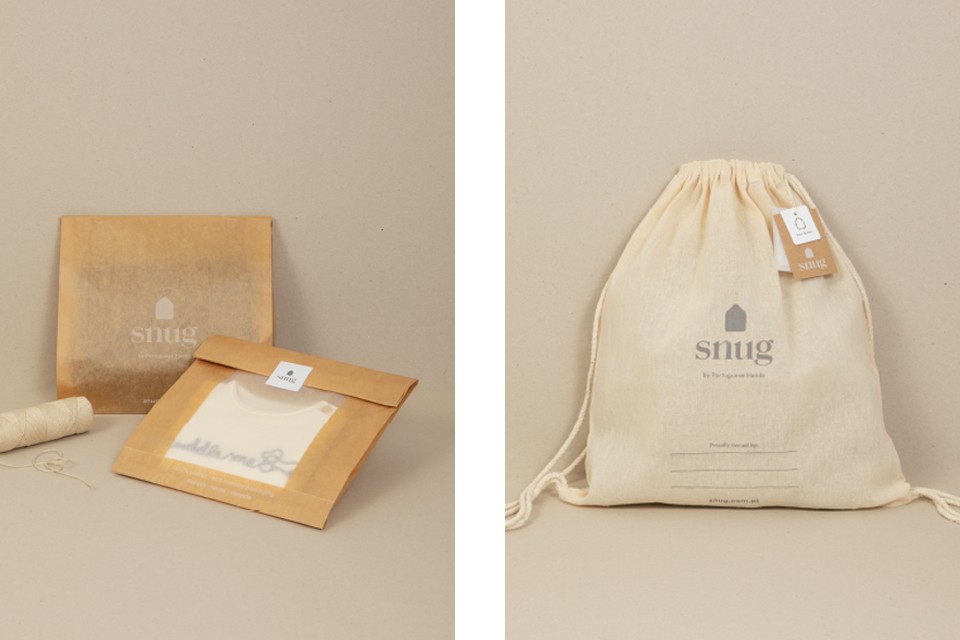 Sustainable, plastic-free packaging with a reusable cloth bag for children's clothing.
