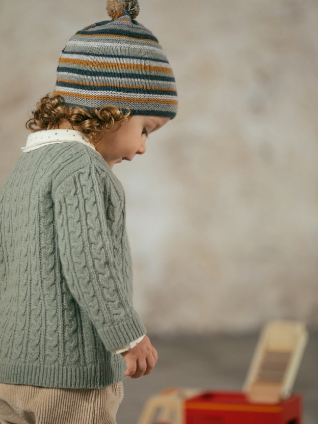 Beanie with pom-pom and embossed stripes