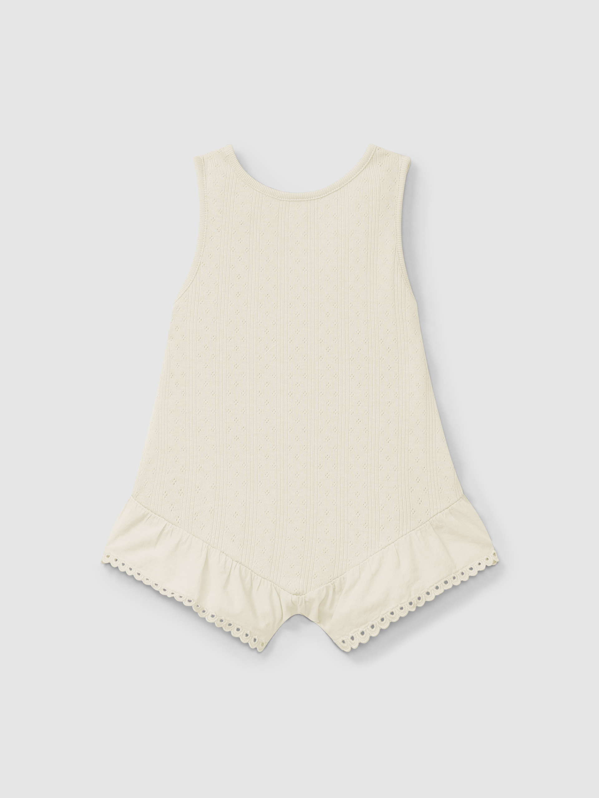 Mono ajour con bordado inglés