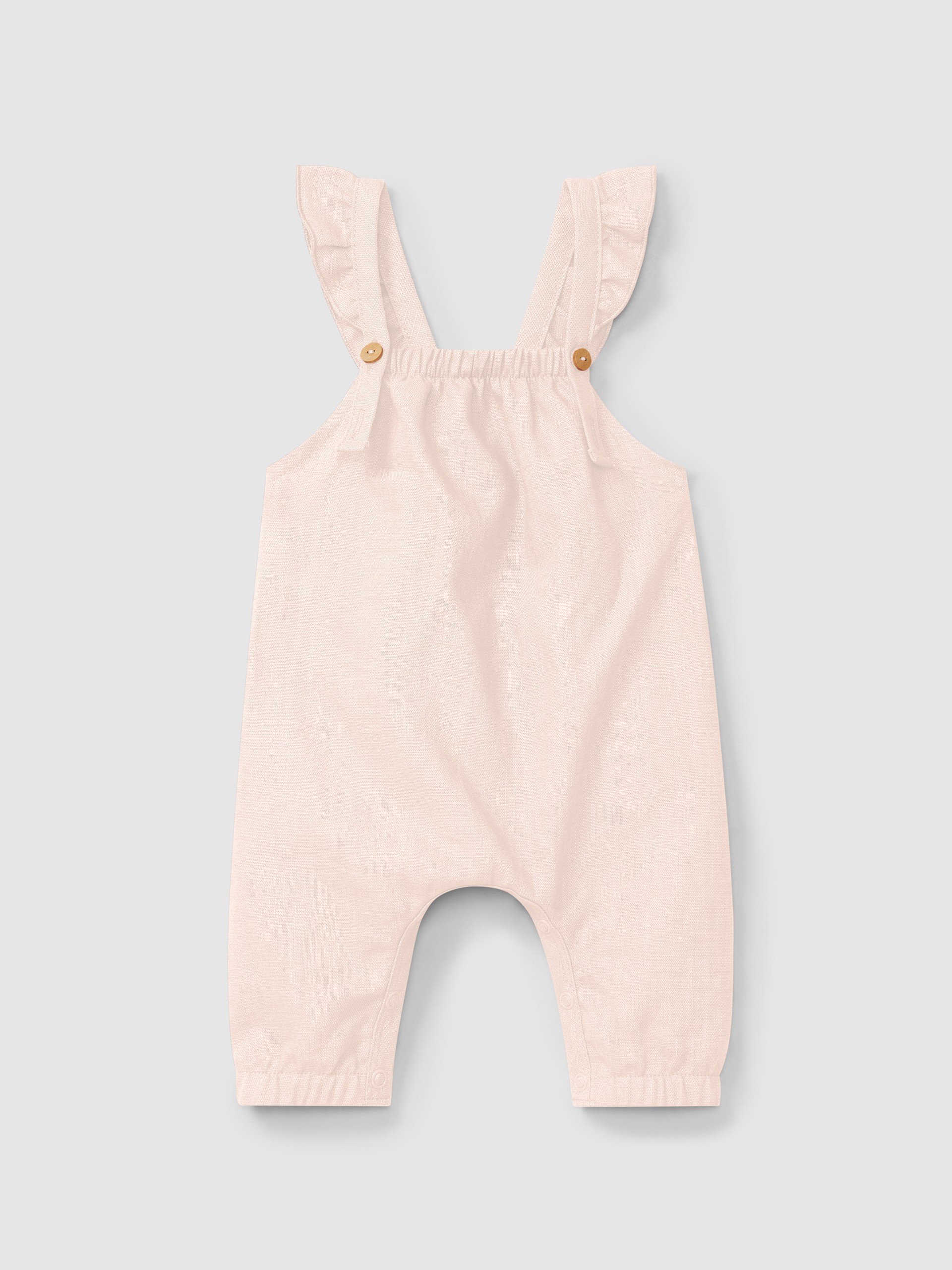 Jardineiras lisas em linho com algodão e alças com folho