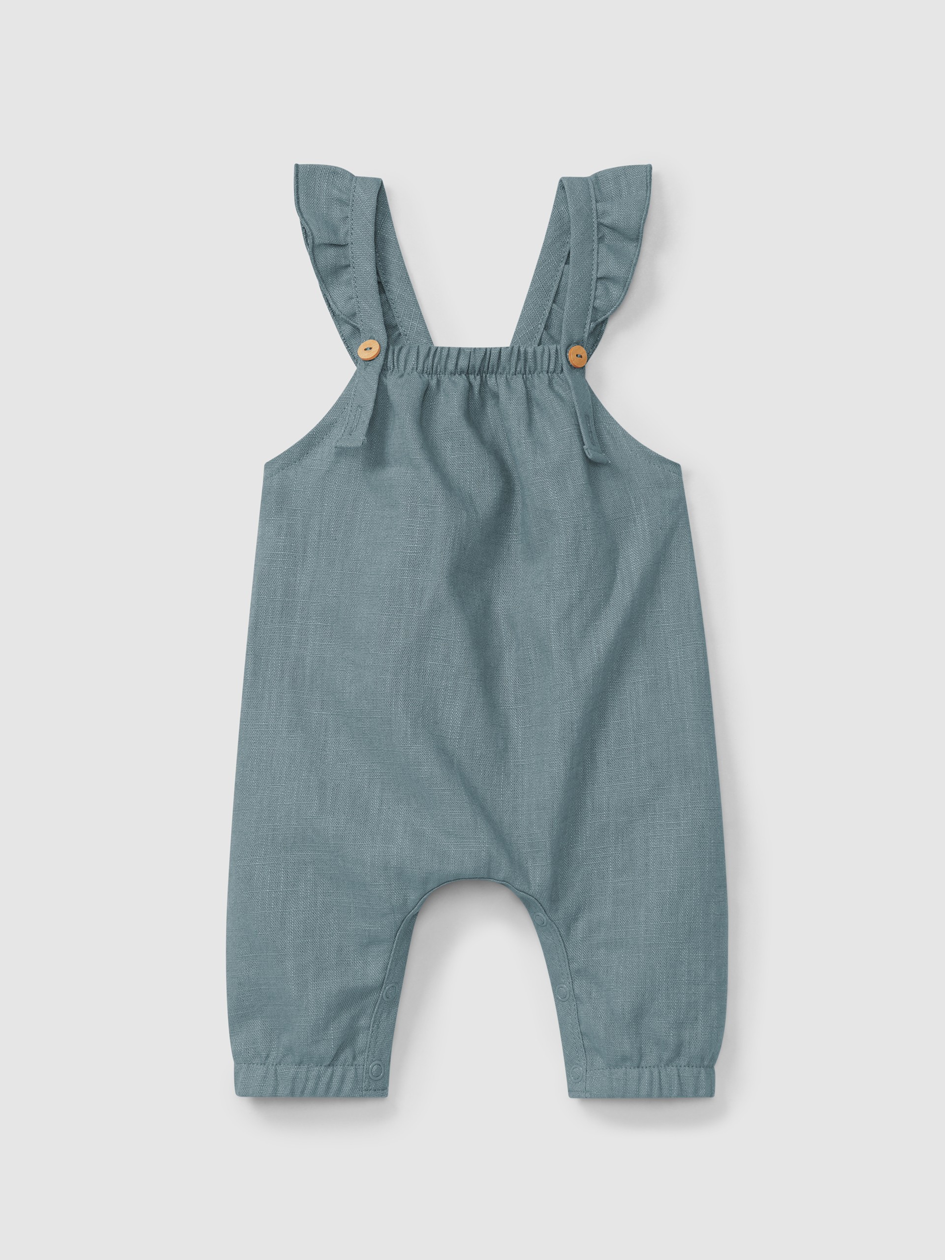 Jardineiras lisas em linho com algodão e alças com folho