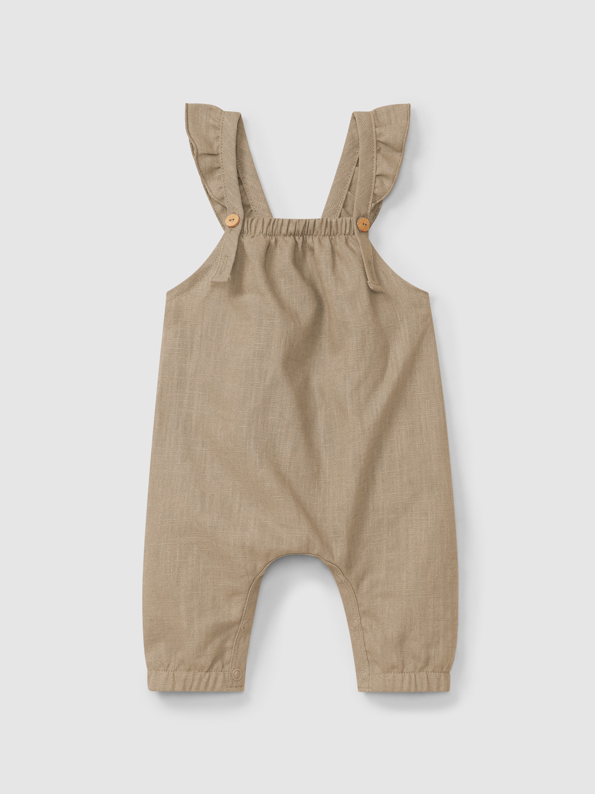 Jardineiras lisas em linho com algodão e alças com folho