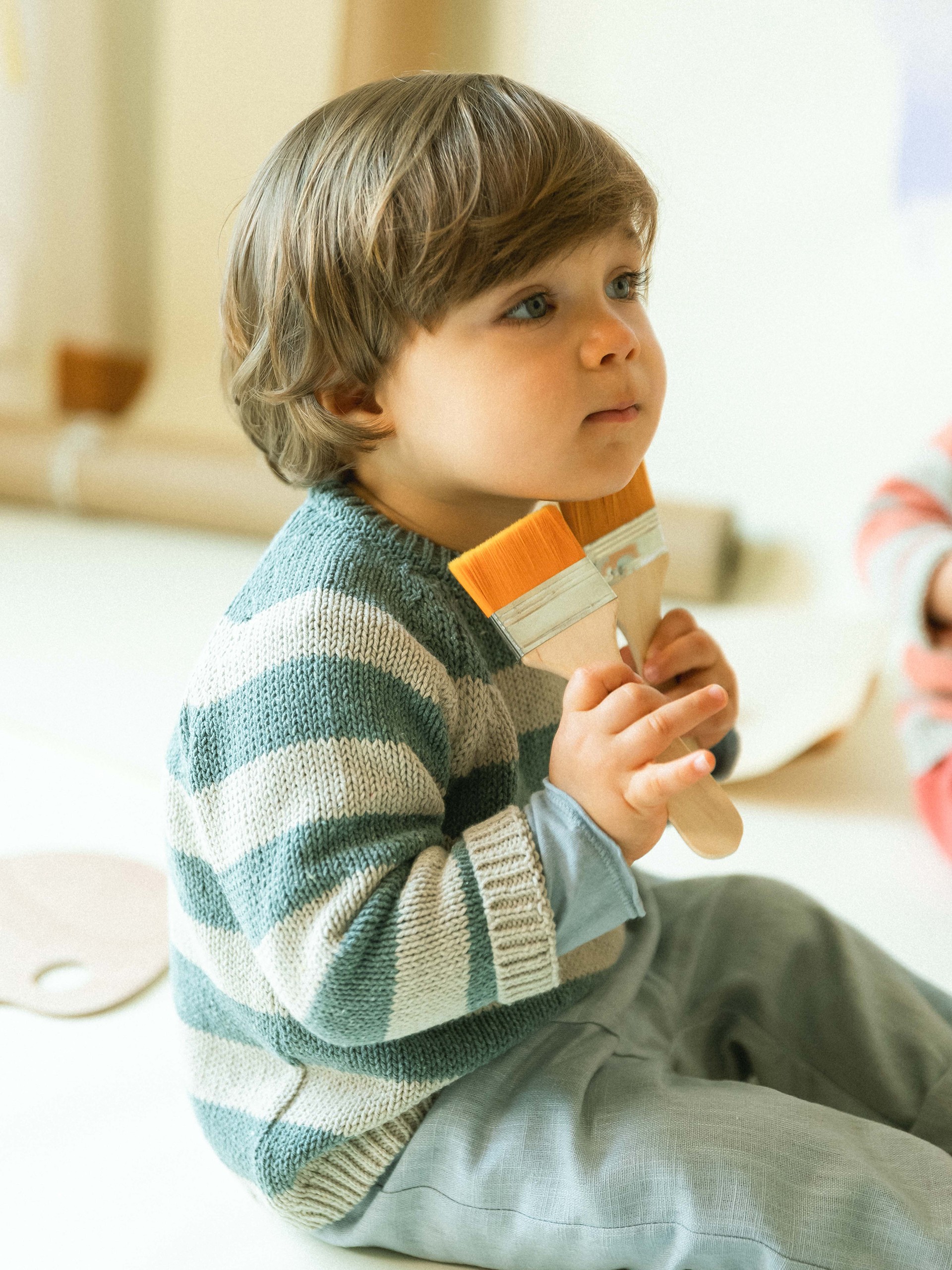 Camisola tricotada de riscas