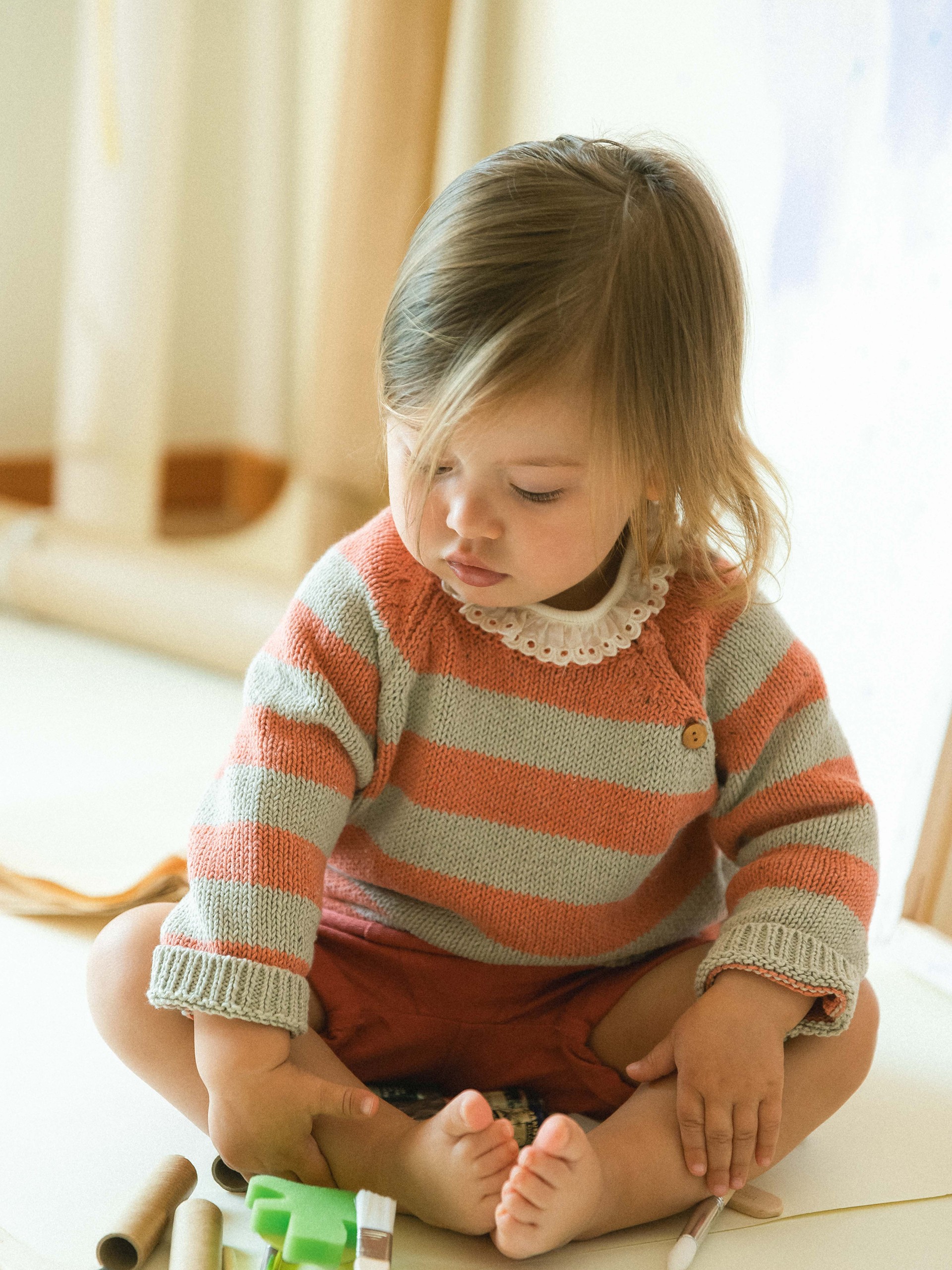 Camisola tricotada de riscas