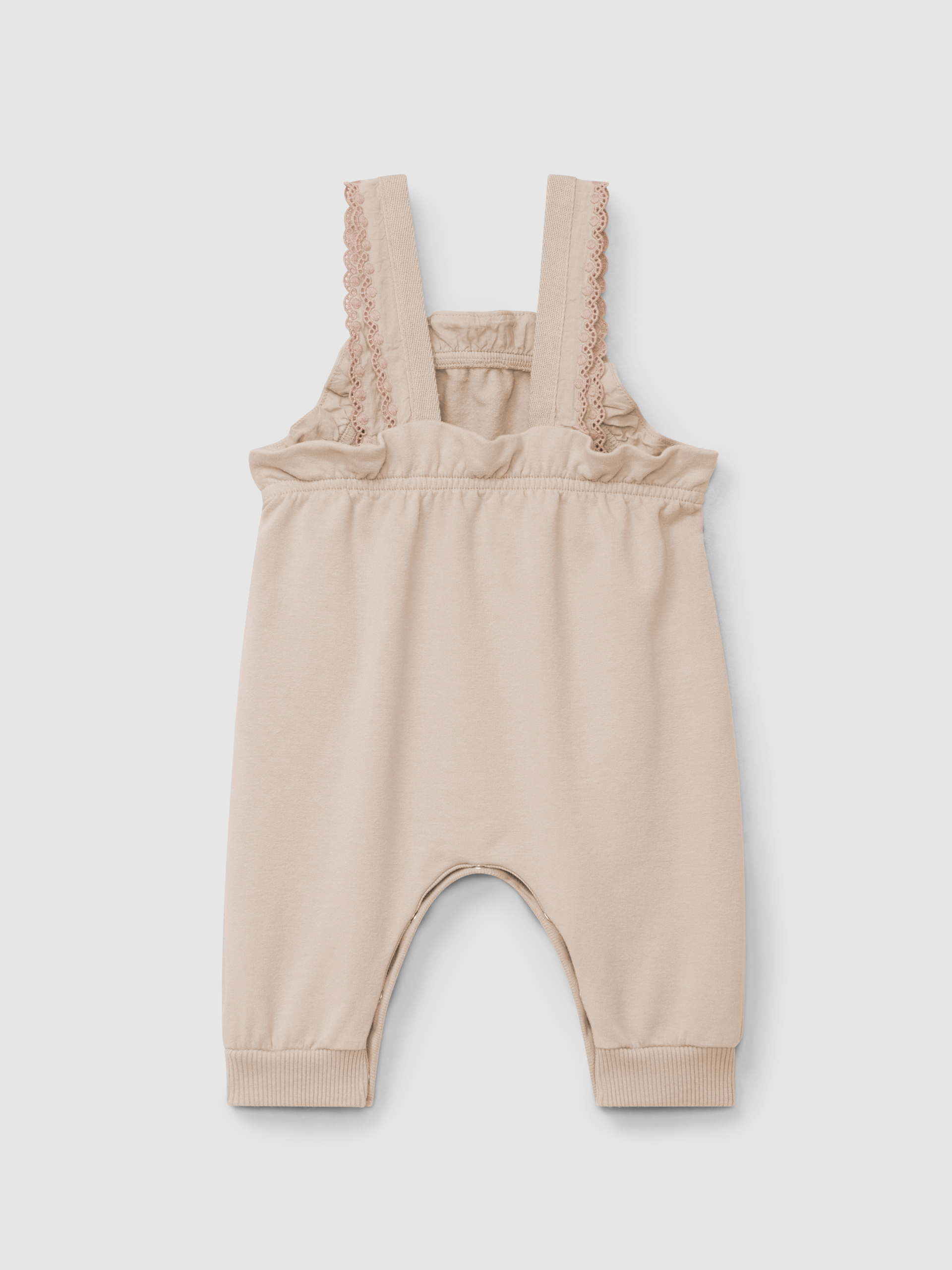 Plush dungarees with ruffled detail with embroidery