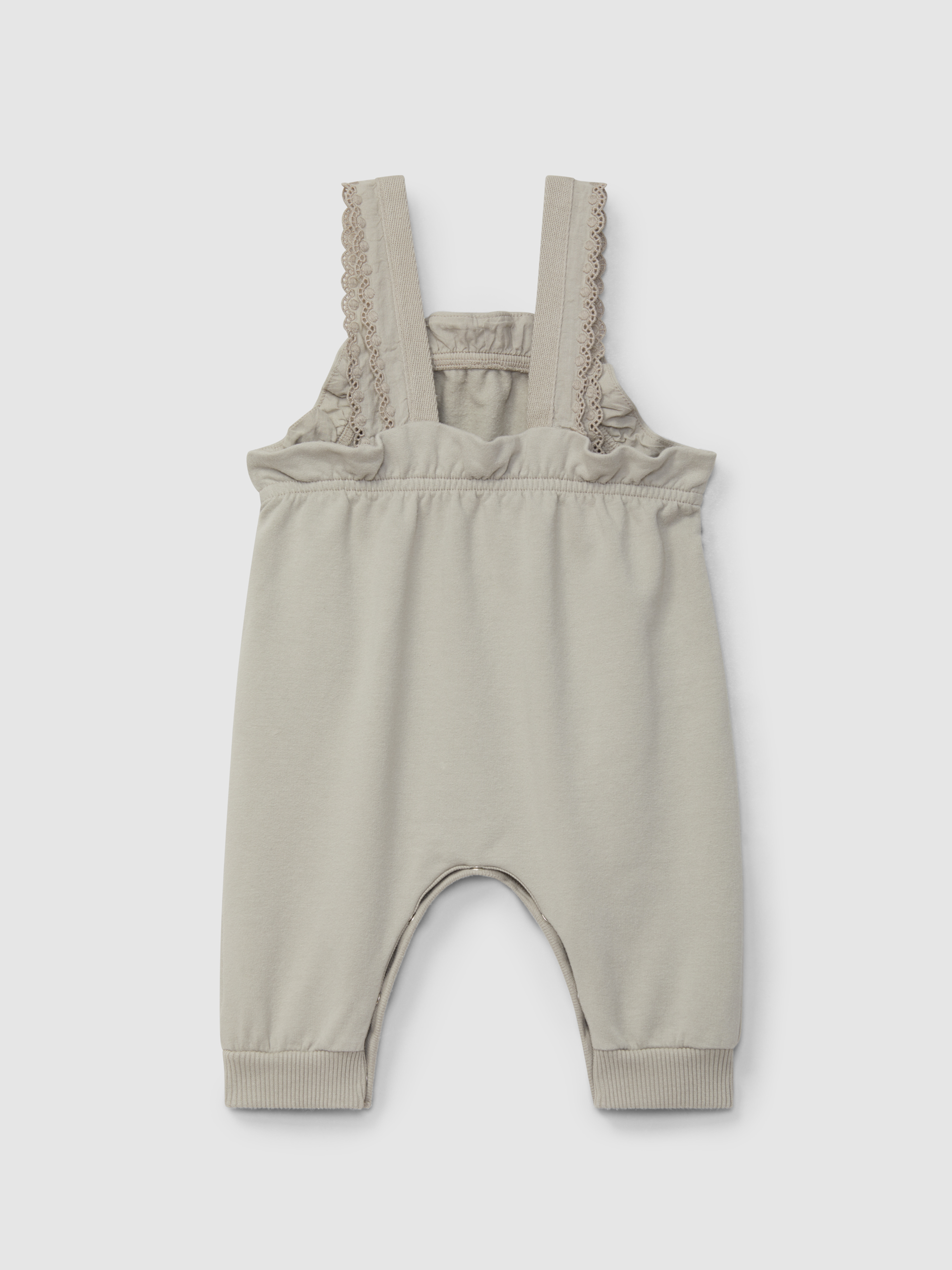 Plush dungarees with ruffled detail with embroidery