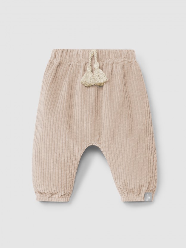 Pull-up pants in ribbed velvet and drawstring detail with pom-pom Pull-up pants in ribbed velvet and drawstring detail with pom-pom
