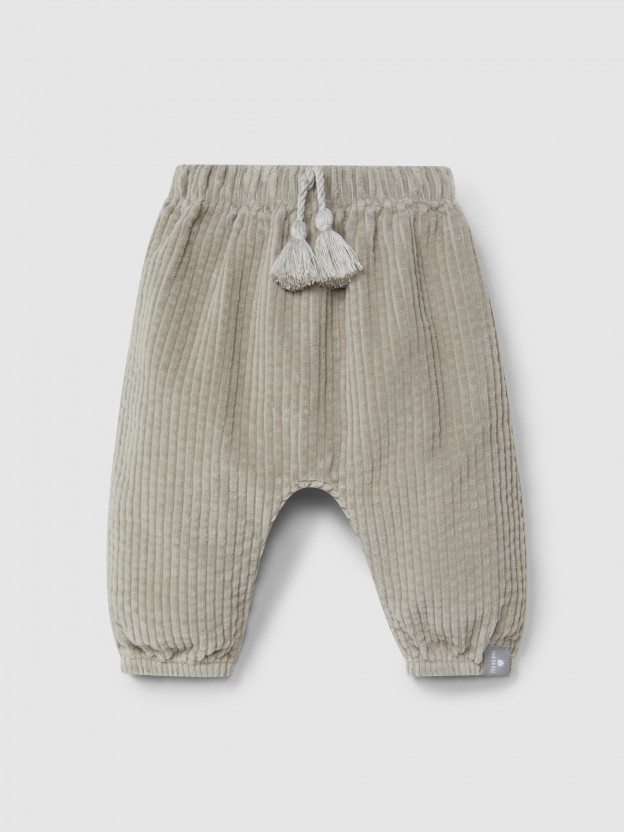 Pull-up pants in ribbed velvet and drawstring detail with pom-pom Pull-up pants in ribbed velvet and drawstring detail with pom-pom