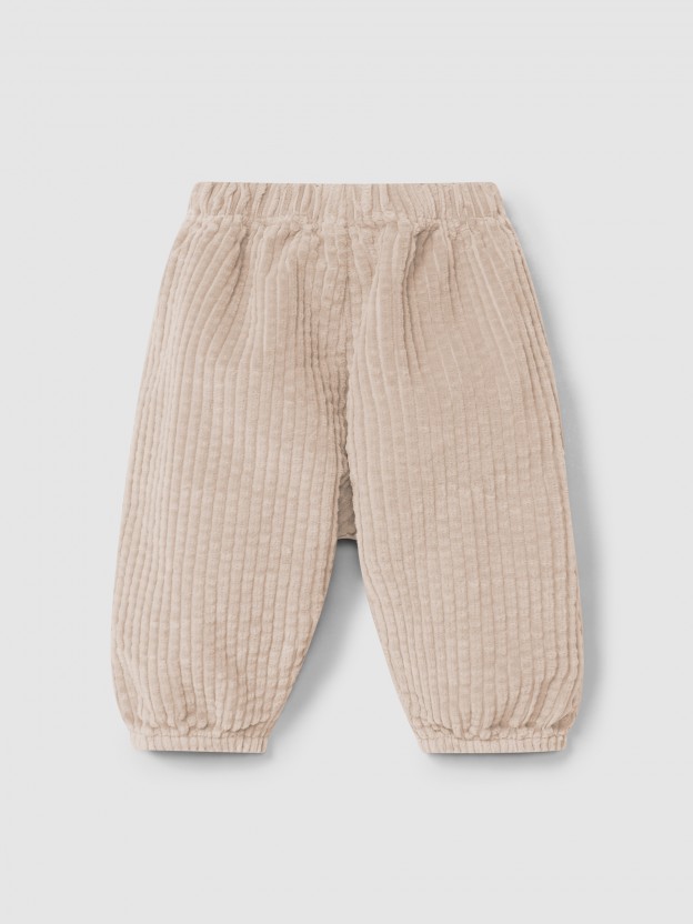 Pull-up pants in ribbed velvet and drawstring detail with pom-pom Pull-up pants in ribbed velvet and drawstring detail with pom-pom