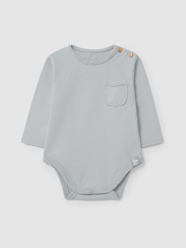 Collarless bodysuit in organic cotton with pocket Collarless bodysuit in organic cotton with pocket