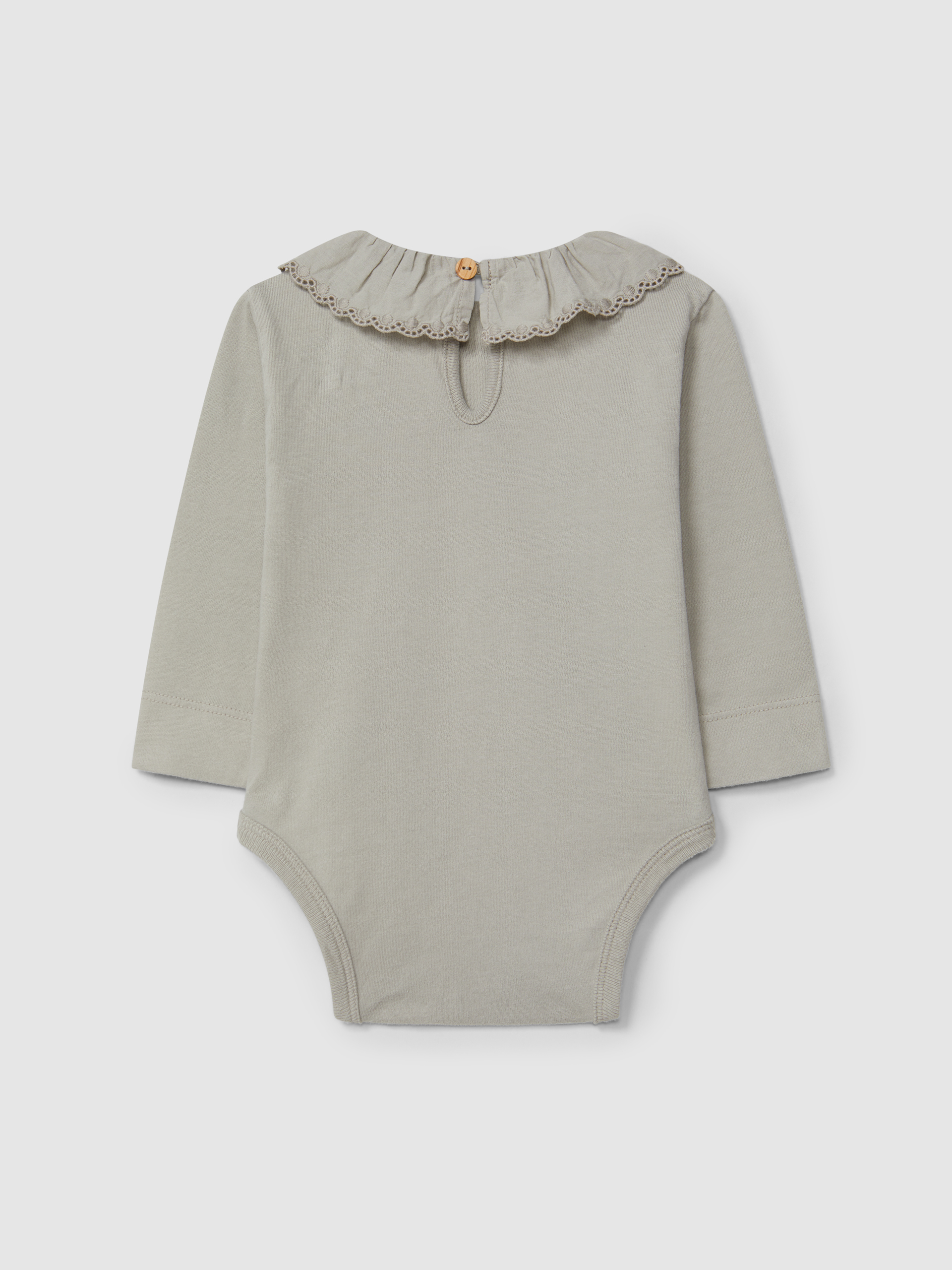 Body con cuello de volante bordado de algodón orgánico