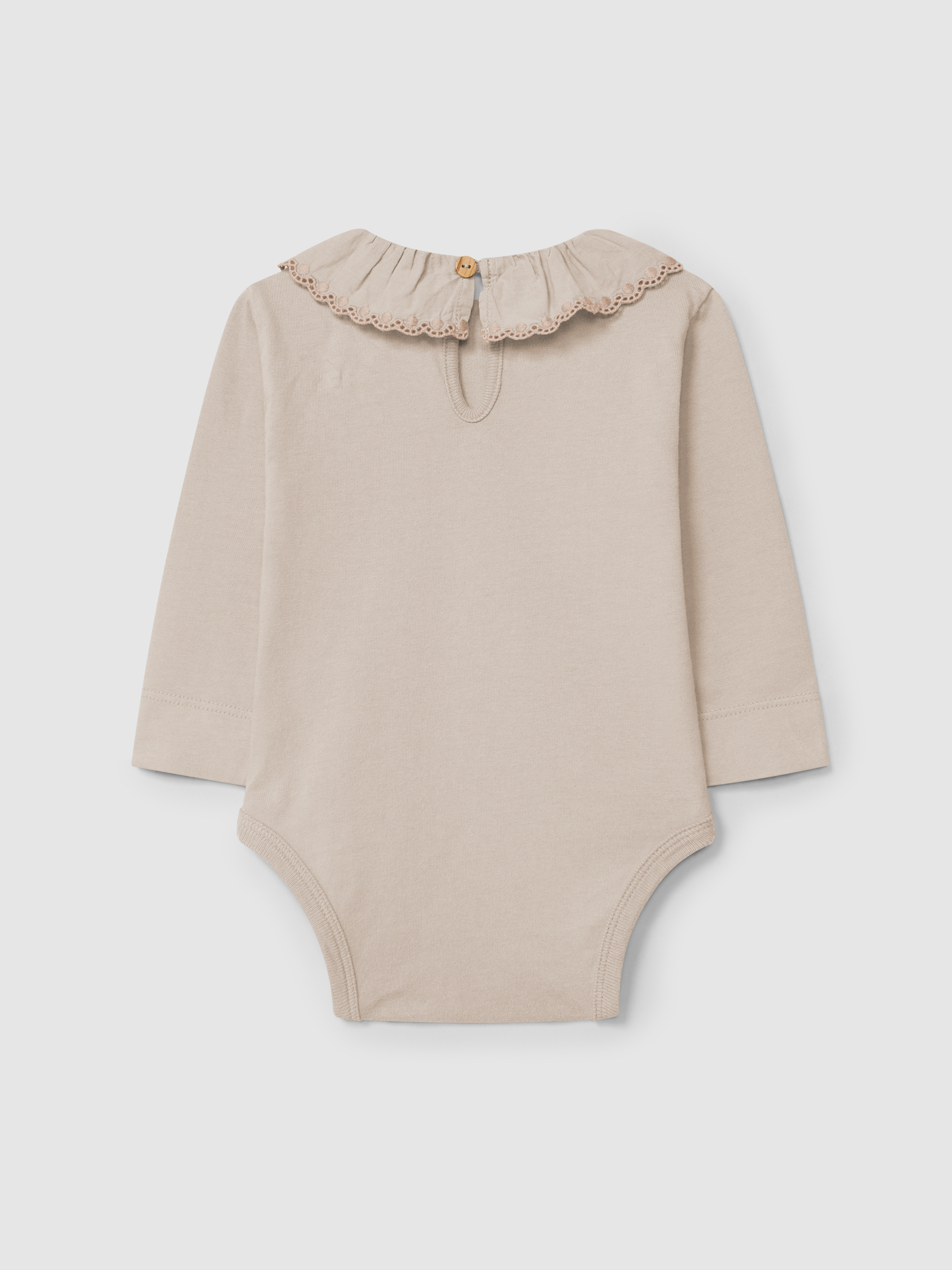 Bodysuit in organic cotton with ruffled embroidered collar