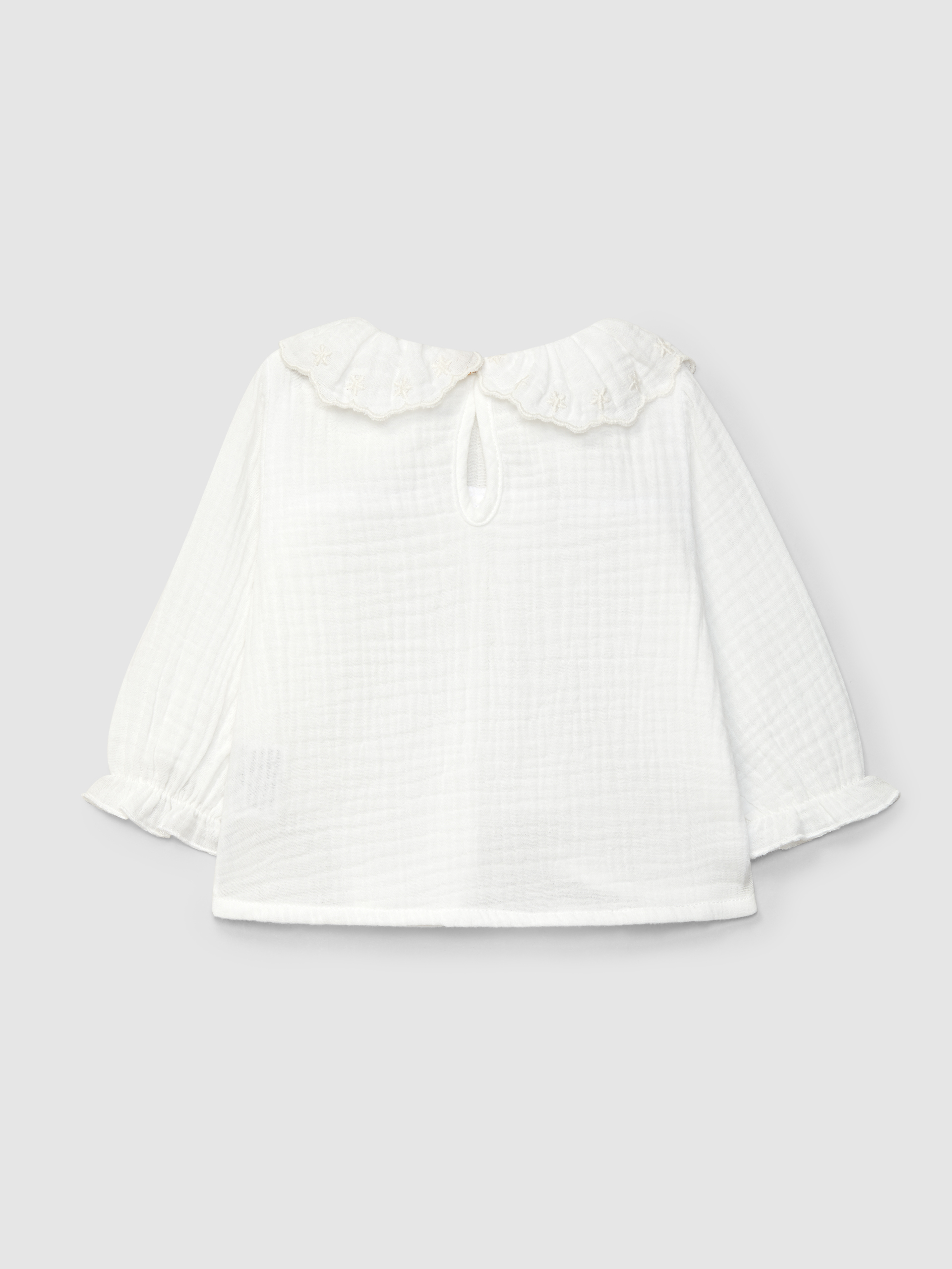 Muslin blouse with embroidered ruffled collar