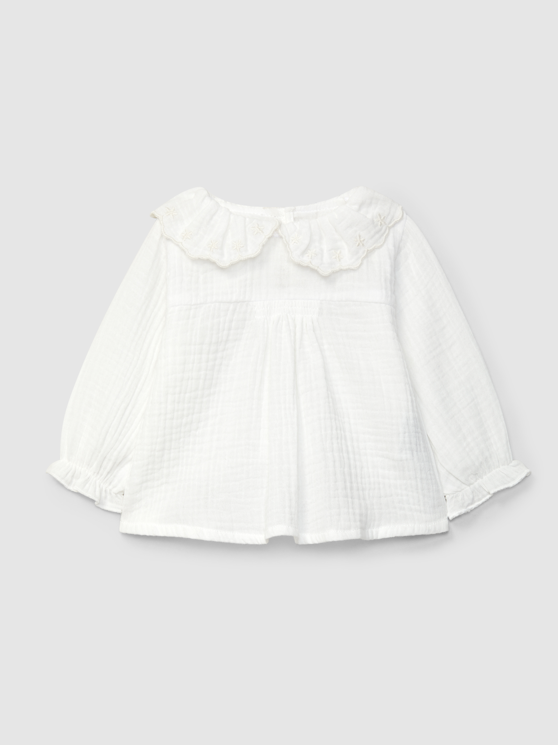 Muslin blouse with embroidered ruffled collar