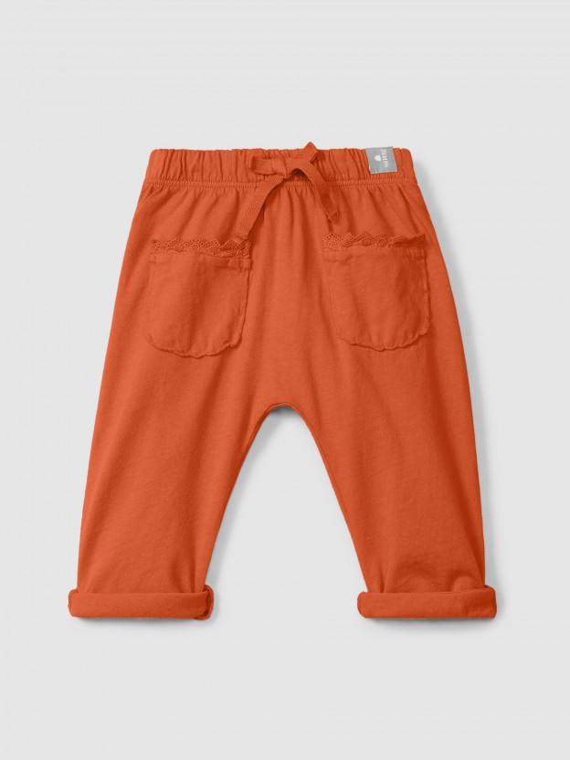 Plain jersey pull-up pants with embroidered details