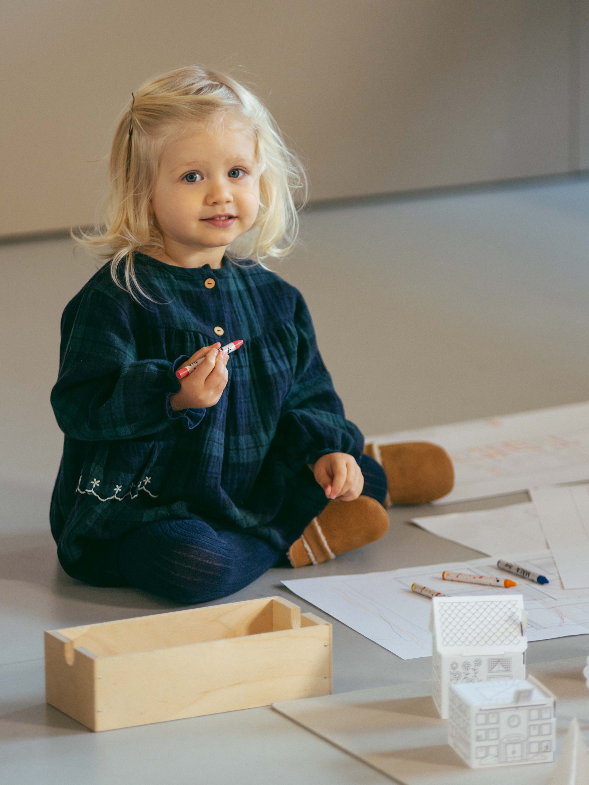 Check dress with embroidered ruffled pocket detail