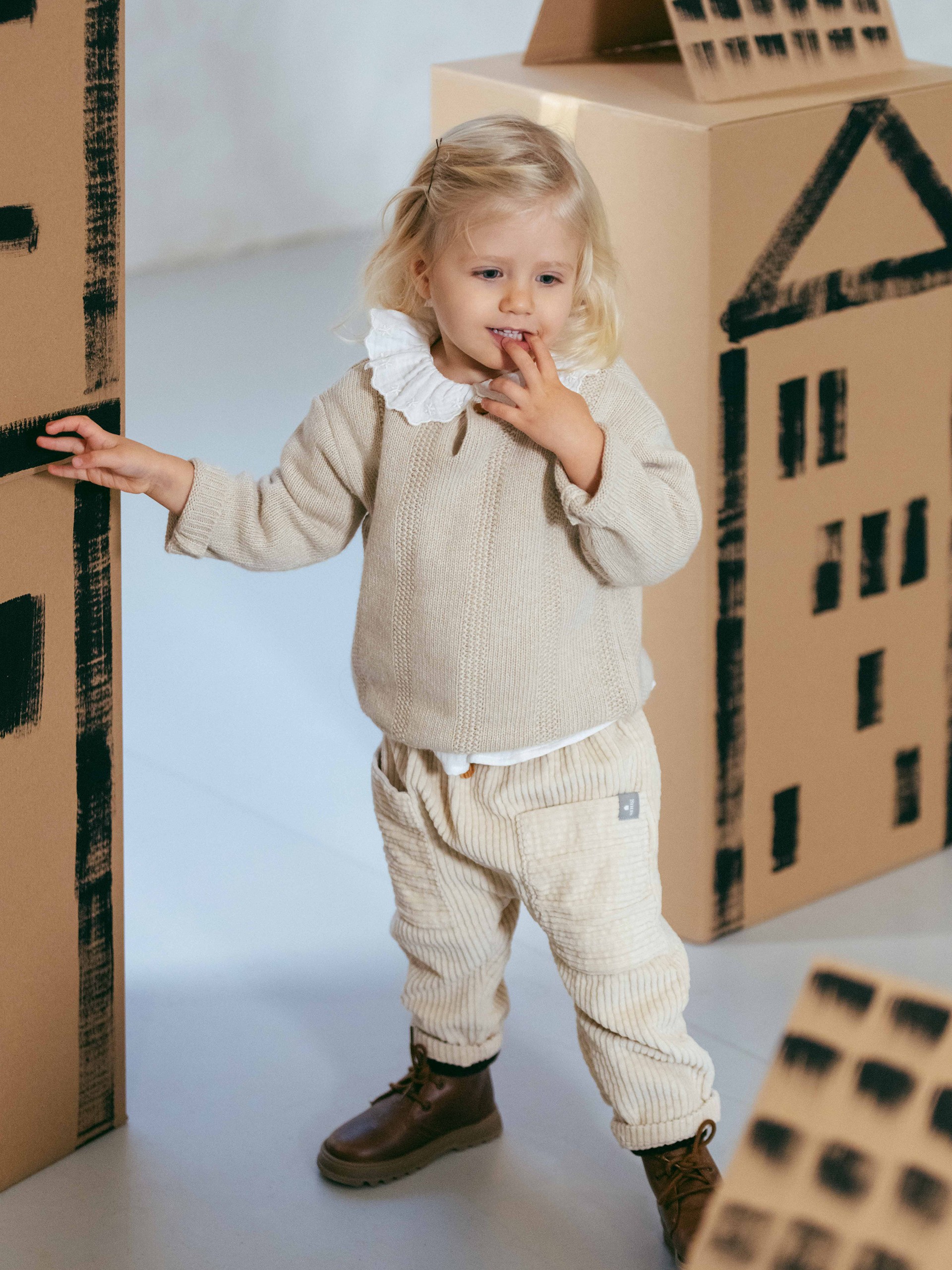 Knitted jumper with rice stitch effect