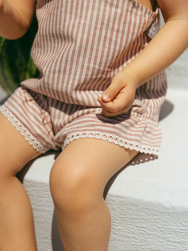 Overalls in striped fabric and English embroidery detail