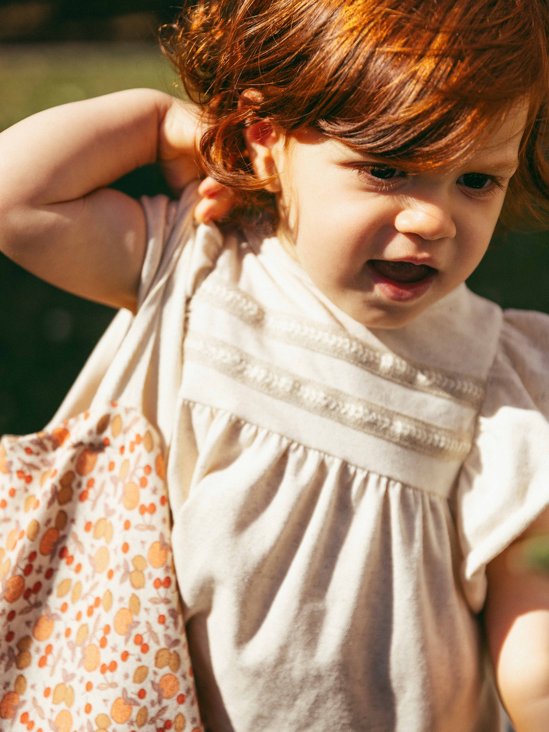 Dress with plaited ribbon detail