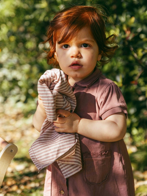 Plain jersey dress with embroidered details