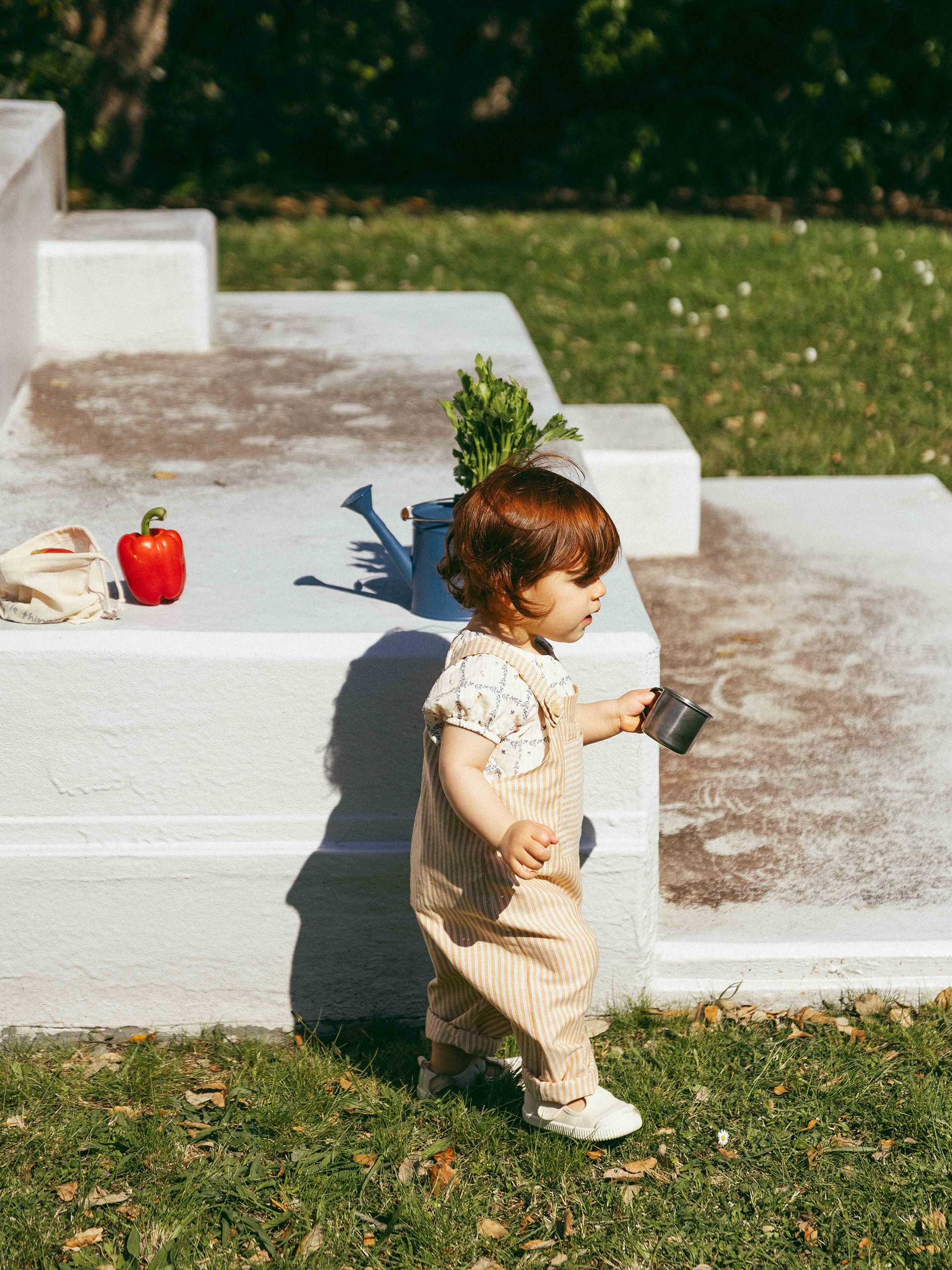Dungarees in striped fabric with pocket