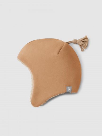 Beanie in plush with pom-pom and fur interior Beanie in plush with pom-pom and fur interior