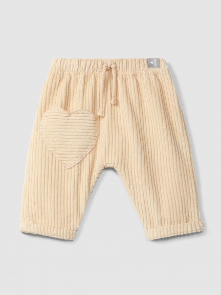 Pull-up pants in ribbed velvet with heart pocket