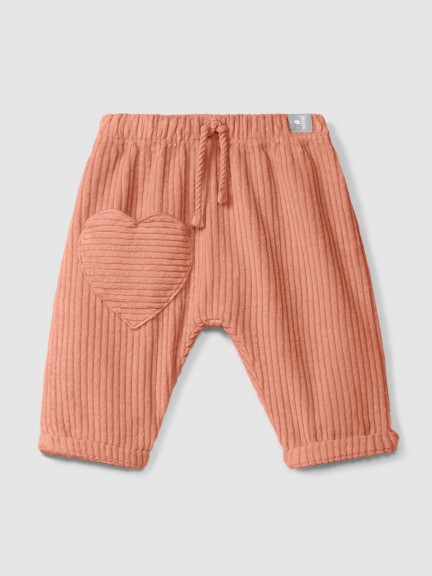 Pull-up pants in ribbed velvet with heart pocket