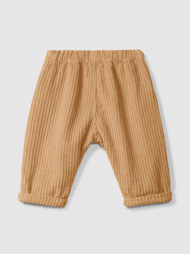 Pull-up pants in ribbed velvet with pocket