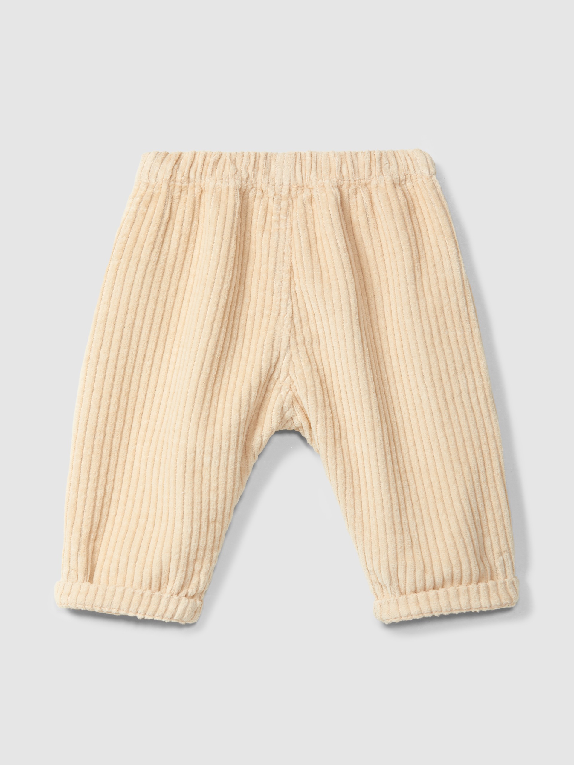 Pull-up pants in ribbed velvet with heart pocket