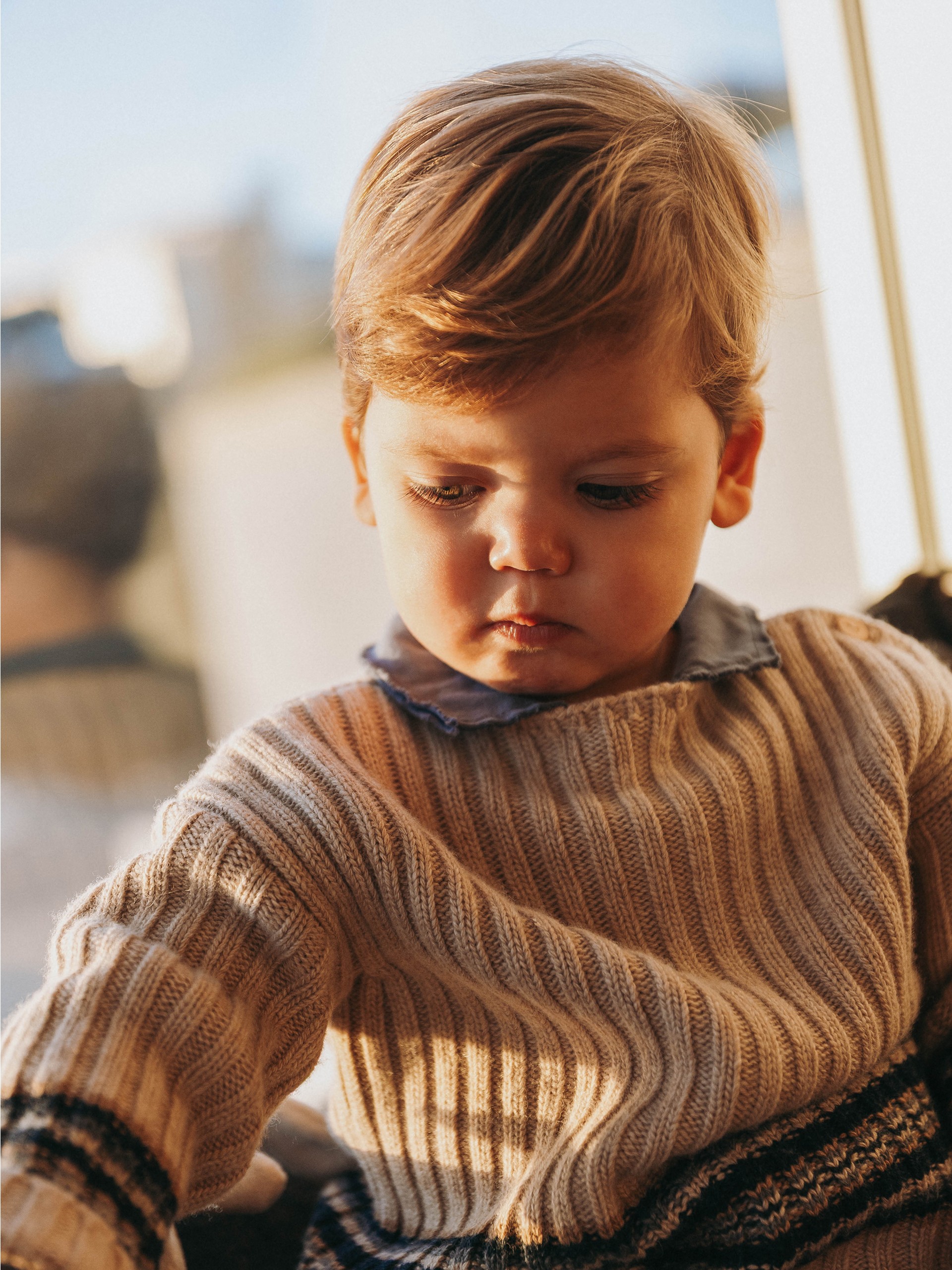 Knitted jumper with striped hem