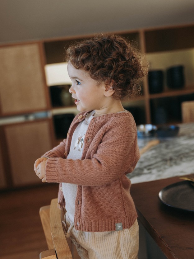 Knitted cardigan with a round neck