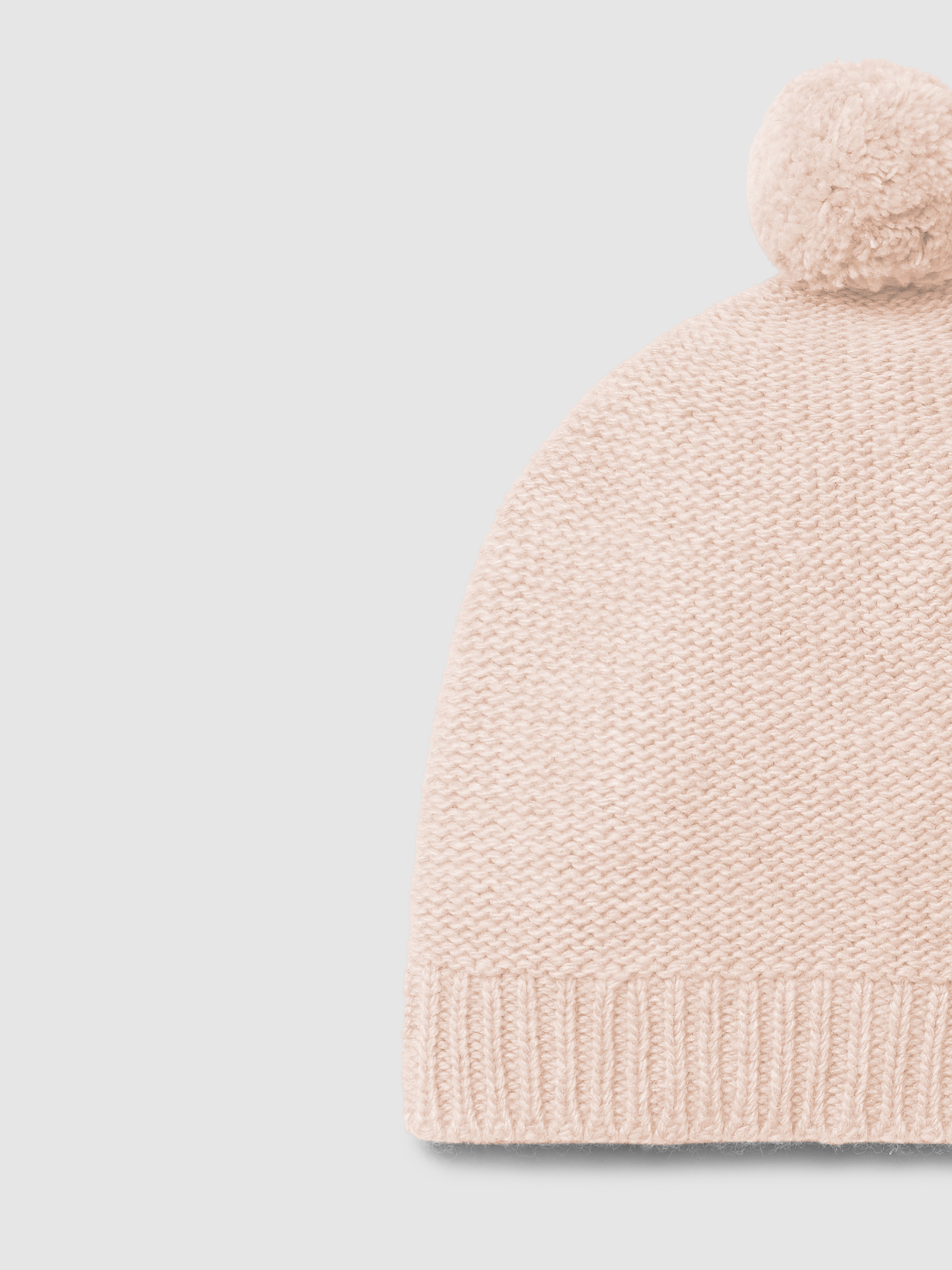 Knitted beanie with pom-pom