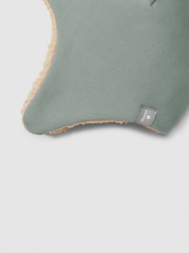 Beanie in plush with pom-pom and fur interior Beanie in plush with pom-pom and fur interior